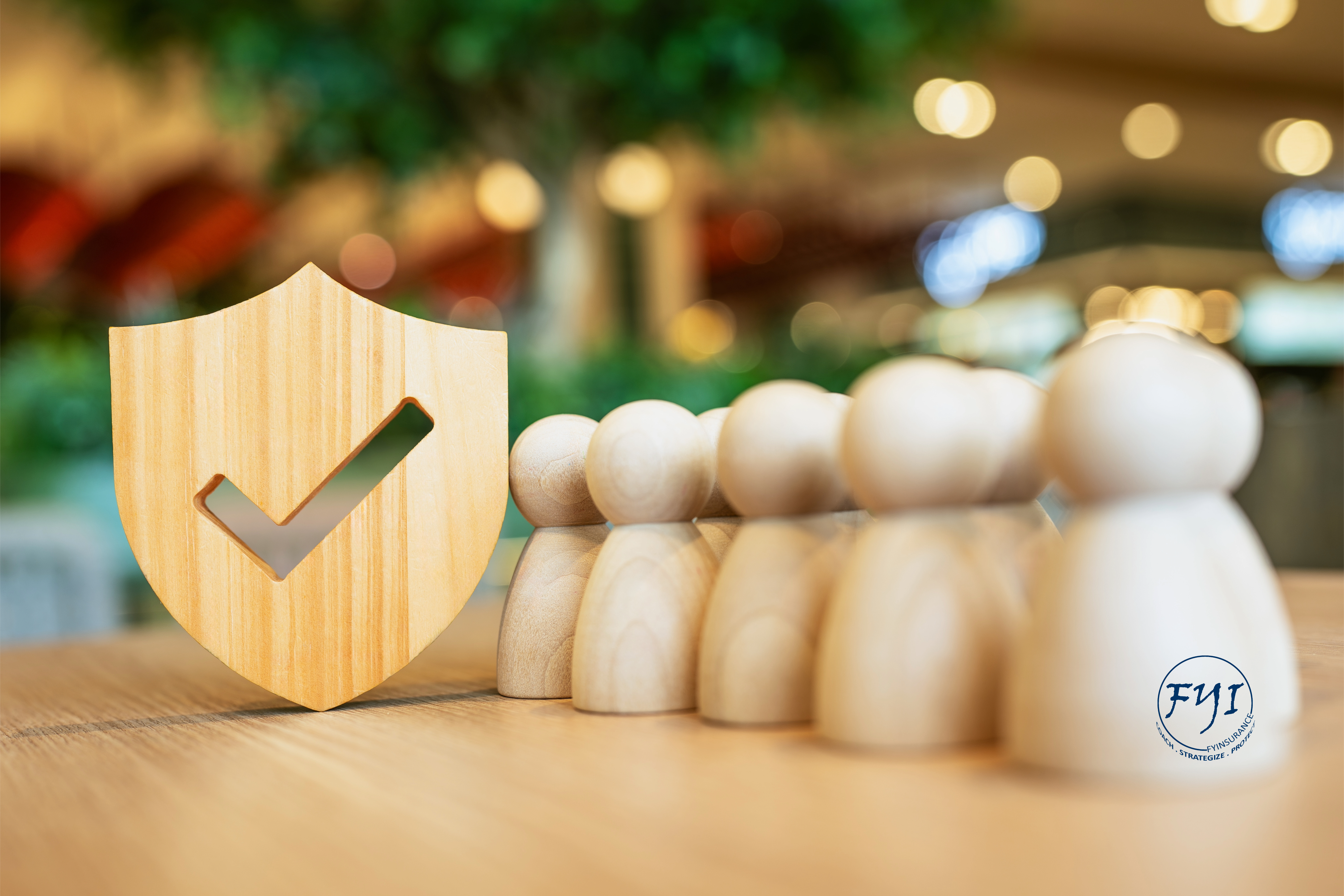 California small business group health insurance concept with shield protecting employee figures—ideal for employers exploring affordable health plans in CA