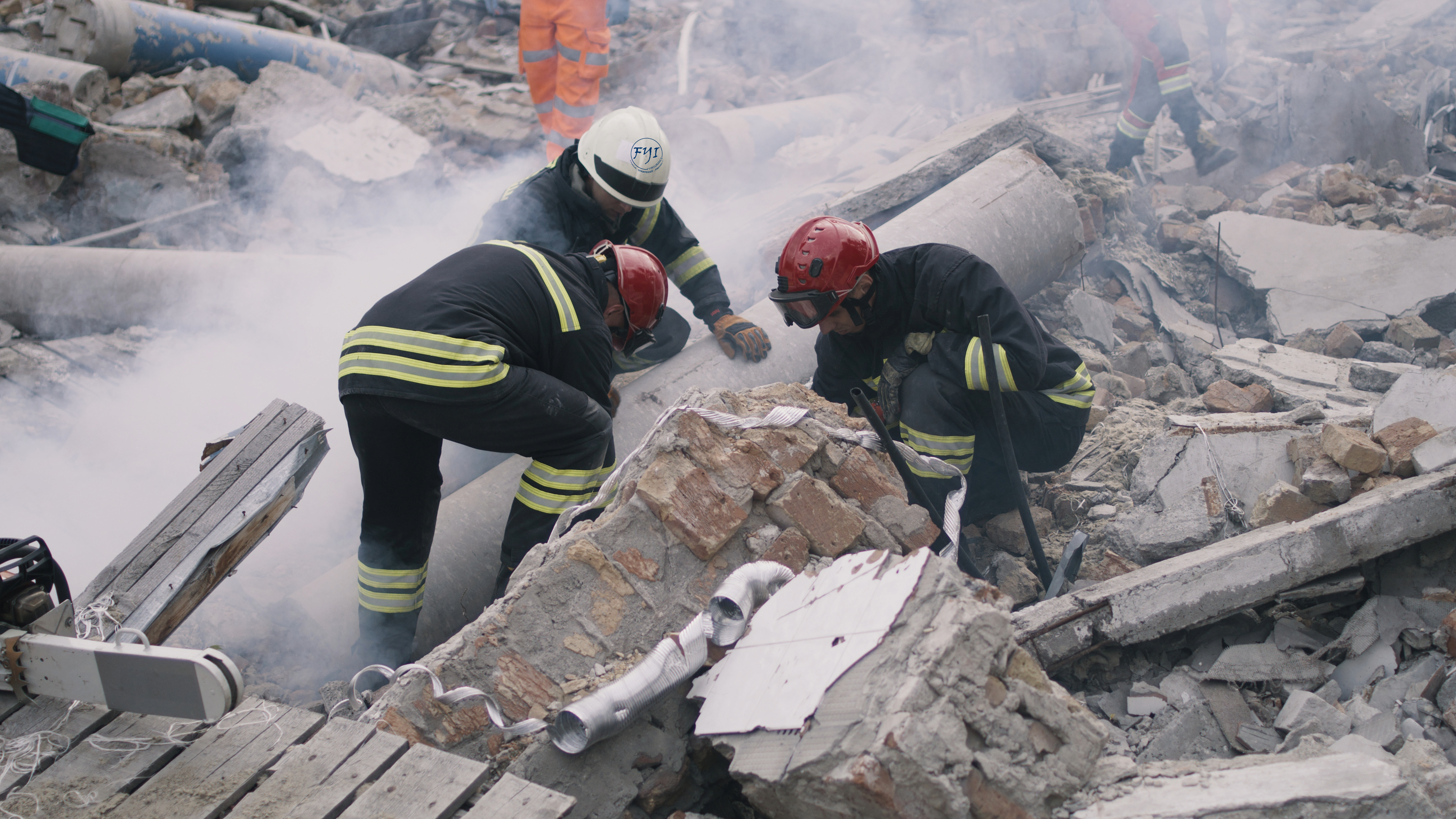 Emergency responders searching through rubble after a destructive event, representing the critical need for terrorism insurance coverage under TRIA for California businesses.