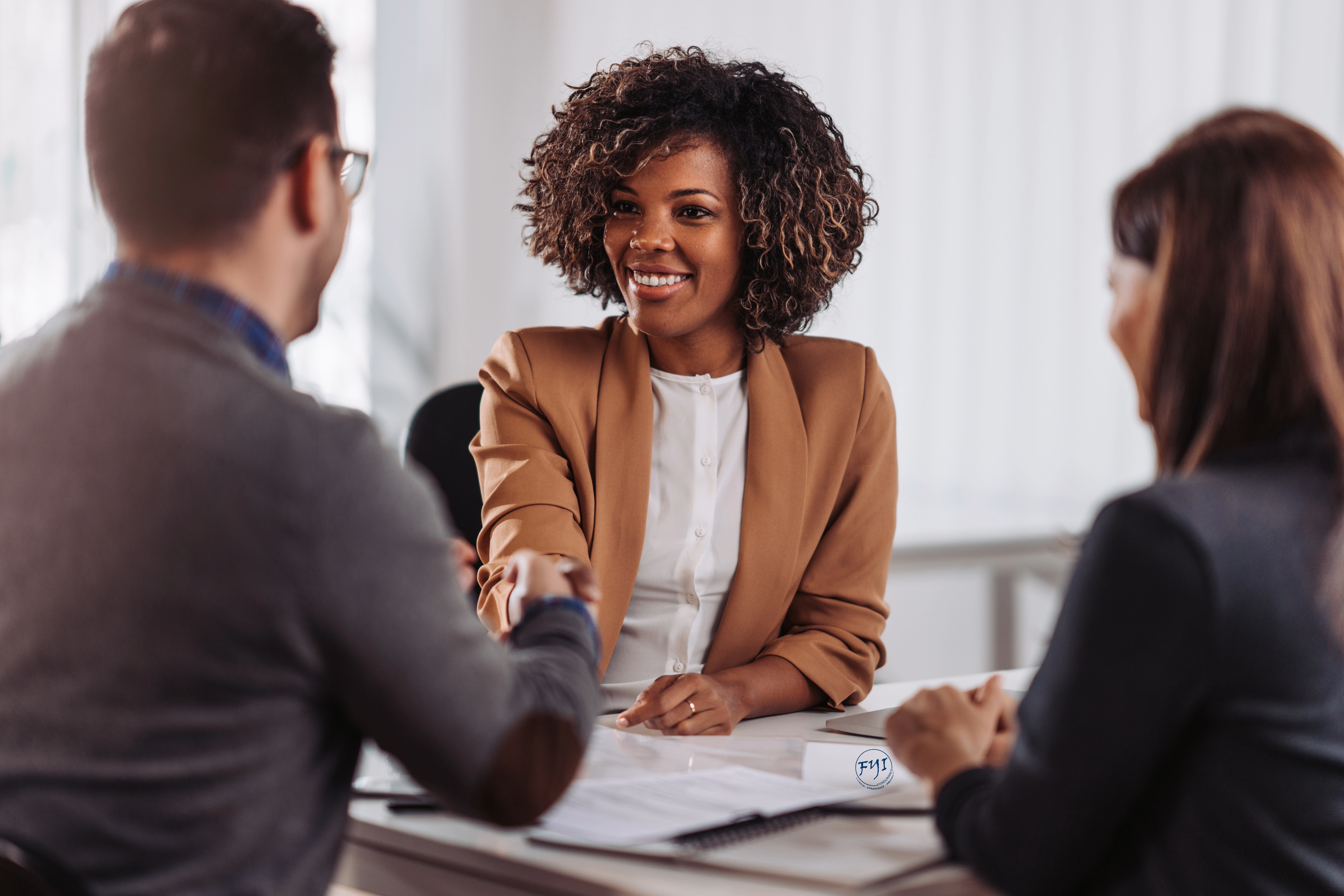 FYInsurance Solutions advisor meeting with business owners to discuss key person coverage and buy-sell agreements, protecting companies from leadership loss due to cognitive decline.