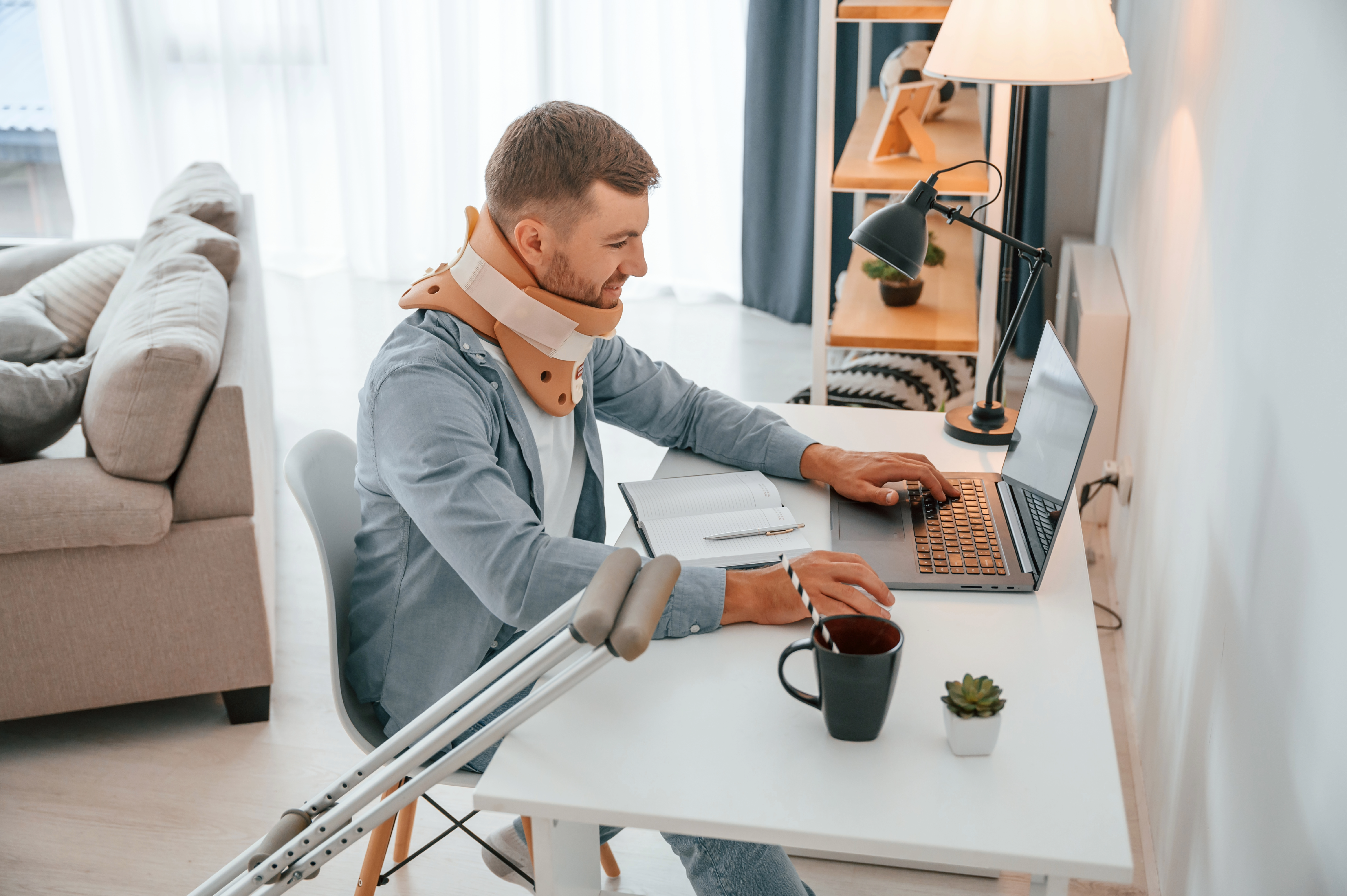 Person with mobility aids and neck brace demonstrating how disability coverage can help maintain financial stability.