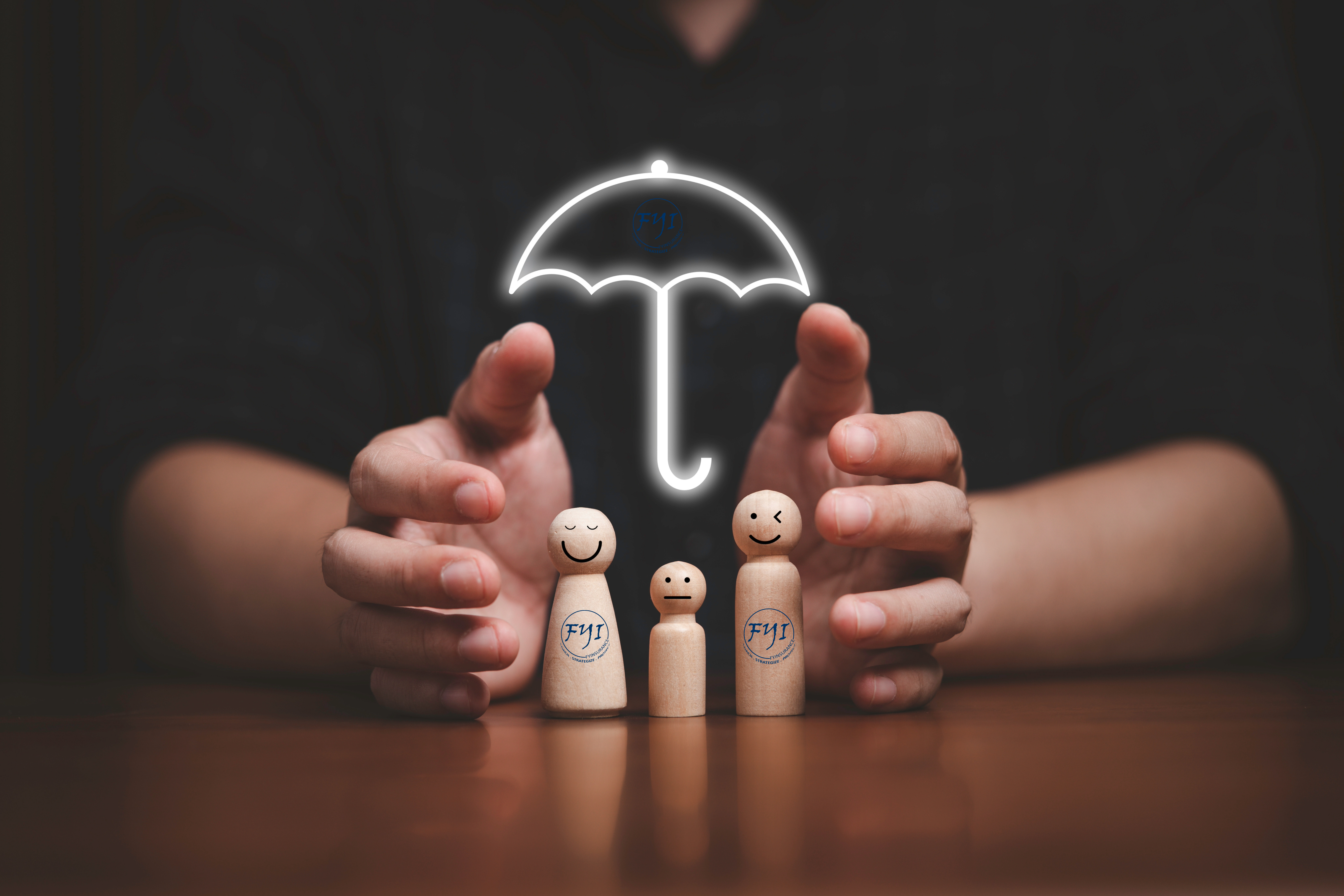 Hands shielding a smiling wooden family under a glowing umbrella labeled FYInsurance Solutions, symbolizing protection through different types of life insurance coverage.